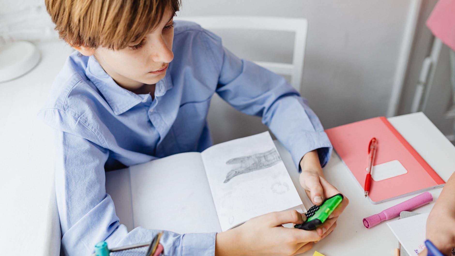 Young boy uses a calculator